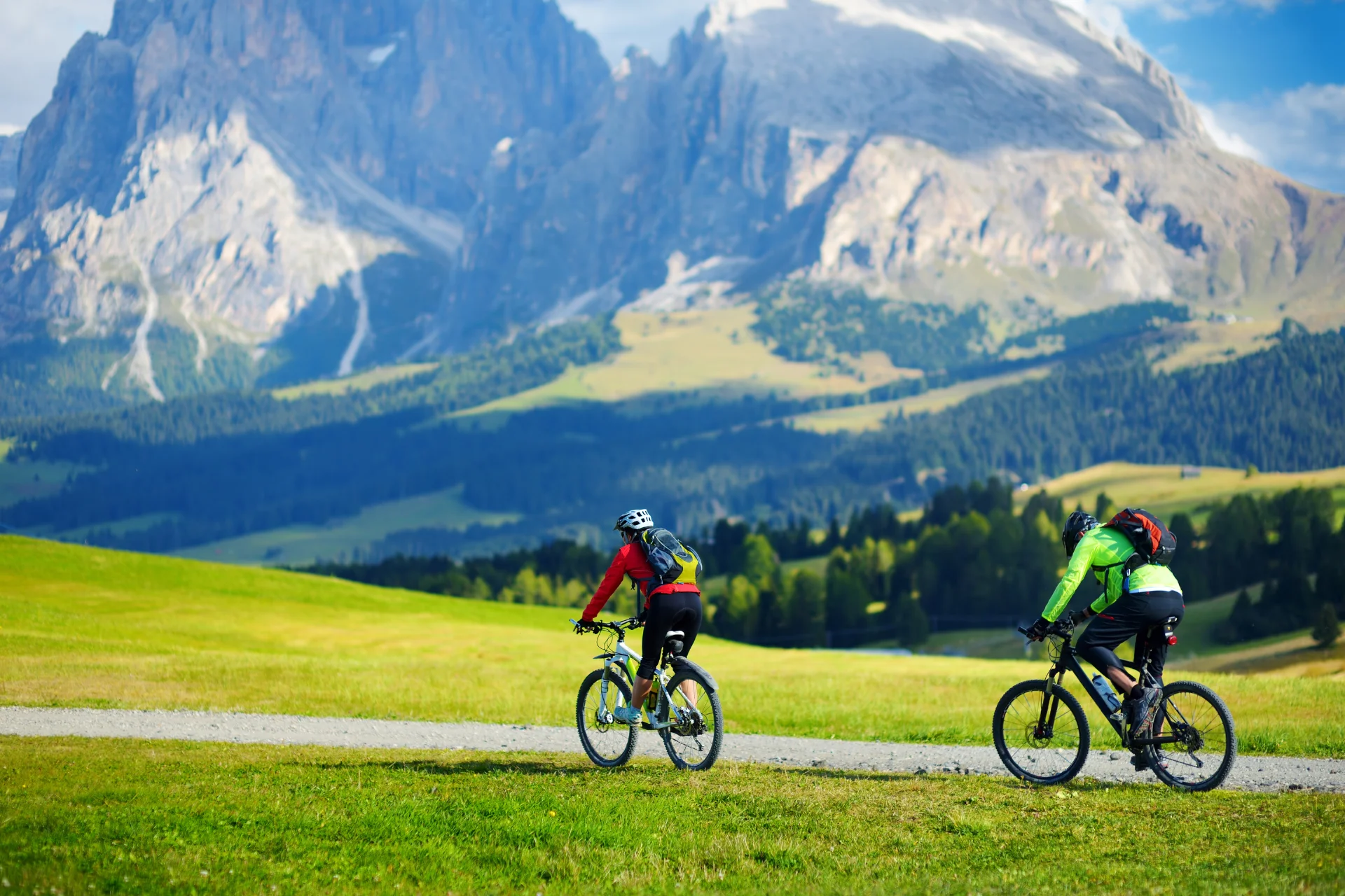 Cyclists in Seiser Alm - High altitude meadow.