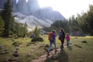 Family hiking in Val Gardena Puez Odle Nature Park.