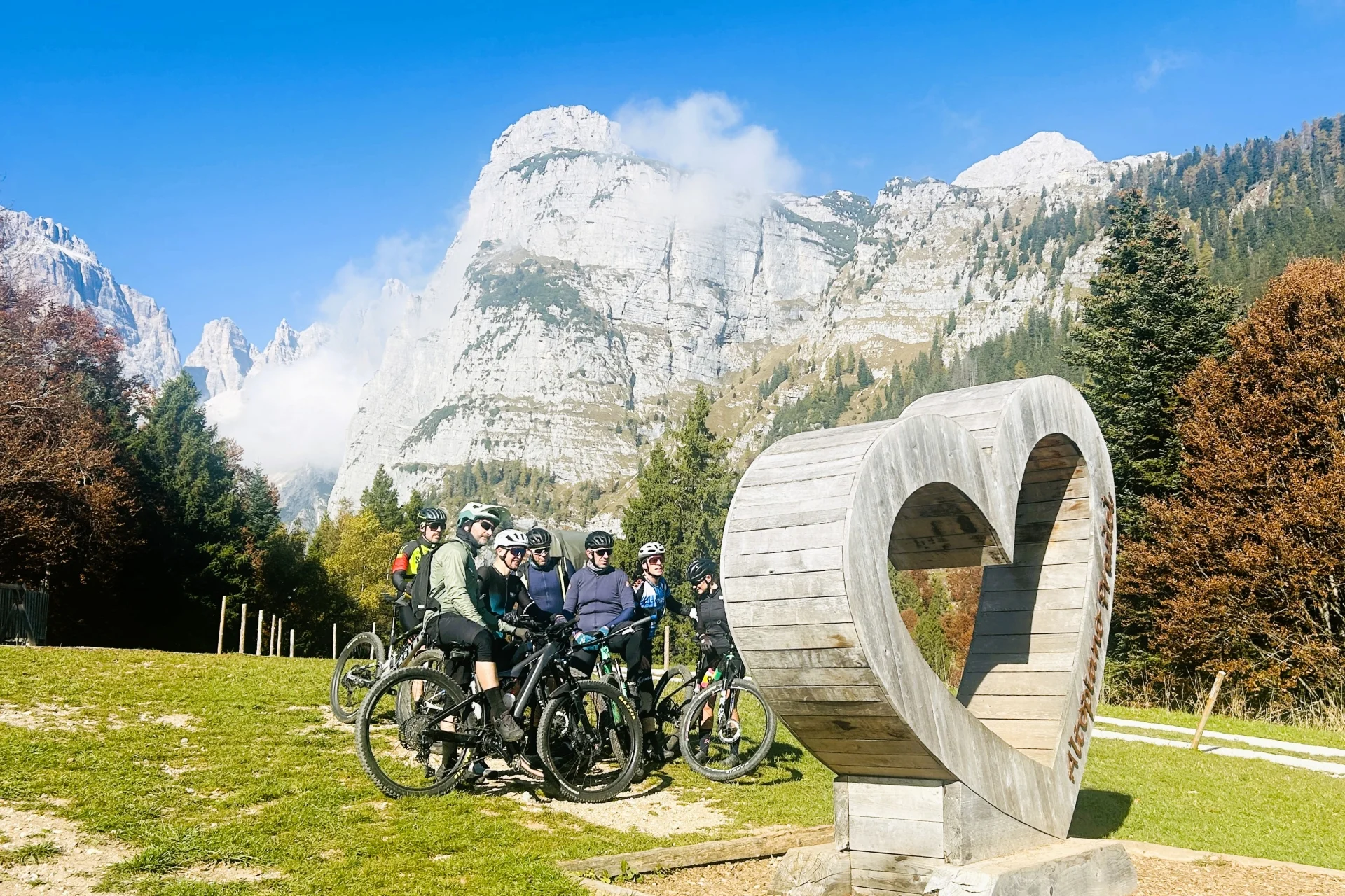 Group of Cyclists at Pradel with the Brenta Mountains in the background.