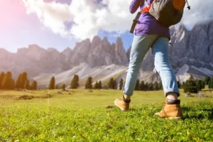 Hiker walking in the Puez-Odle Nature Park - North Eastern Italy.