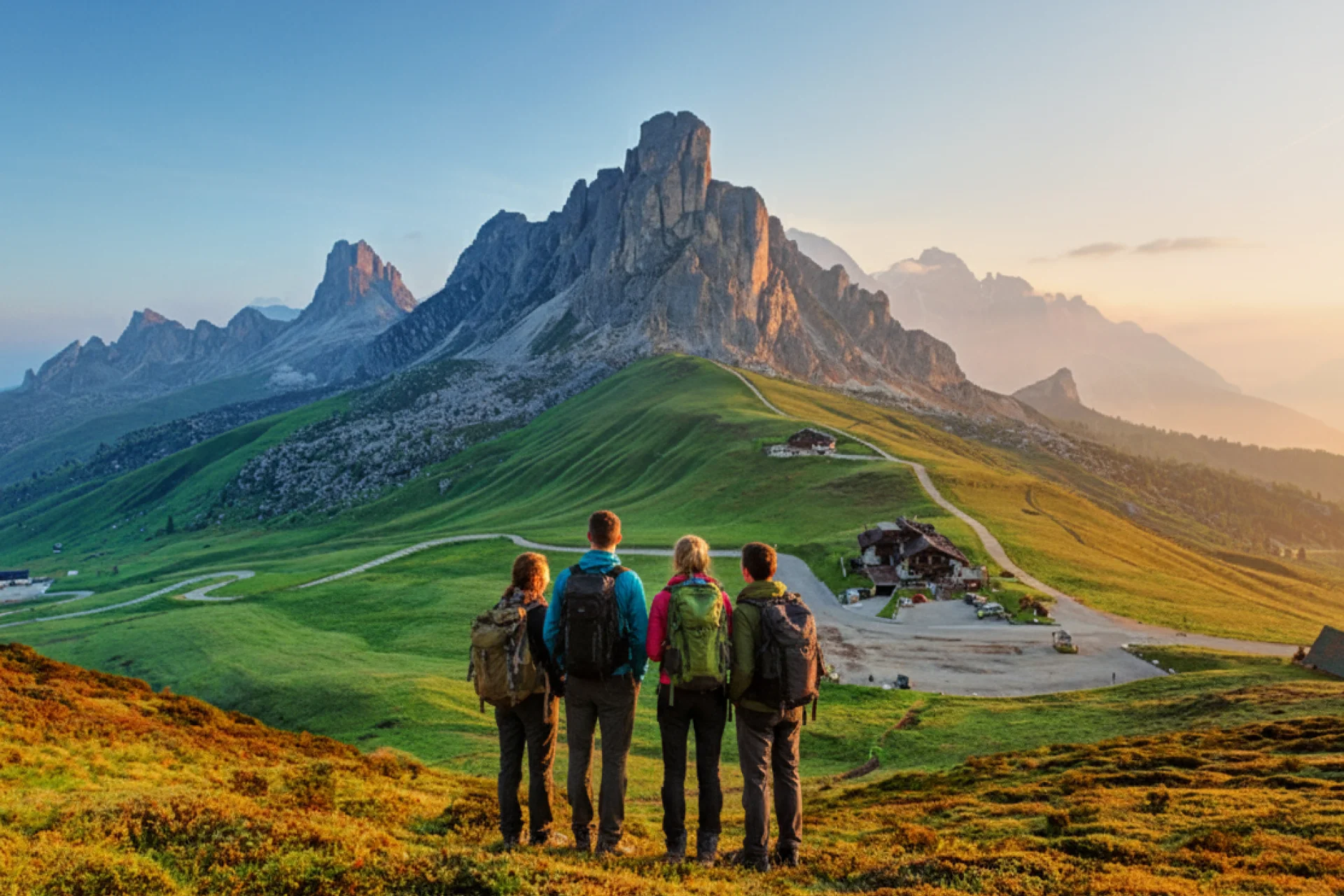 Hiking group at sunset - Dolomite Mountains.