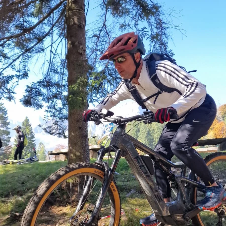 Justin heading down a mountain bike trail in Pradel - Brenta Dolomites.