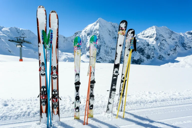 Skis standing on display in the snow.