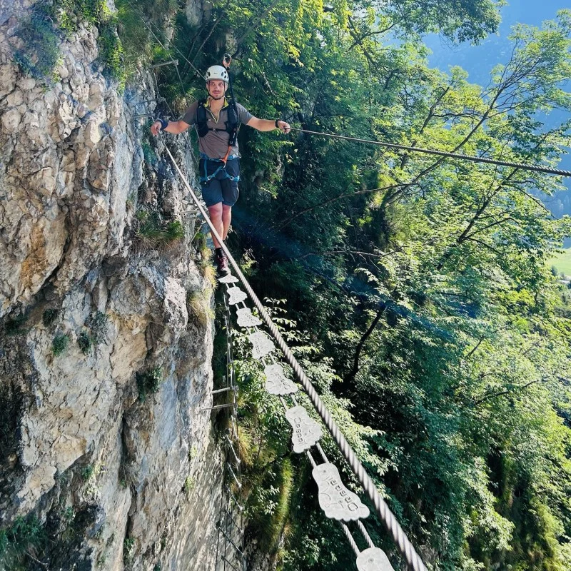 Via Ferrata Signora delle Acque - Ballino Trentino. Crossing a Tibetan bridge.
