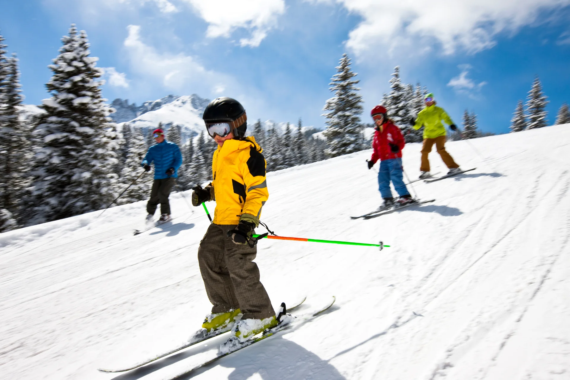 Family skiing on easy runs at a ski resort.