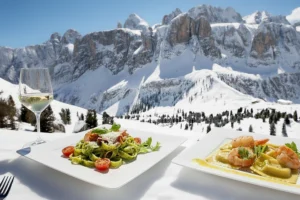 Alta Badia - Taste for Skiing - displaying some gourmet food options.