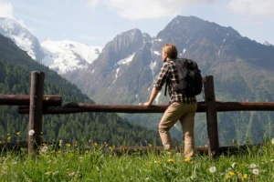 Hiker enjoying the view of Adamello-Brenta Nature Park.