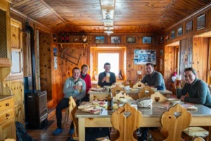 Hikers drinking a beer at a rifugio.