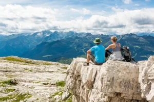Hikers enjoying the view next to Cima Grostè.