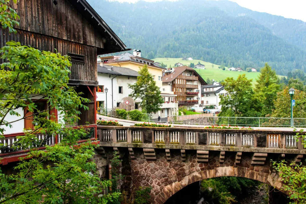 Ortisei village and historic bridge in Val Gardena.