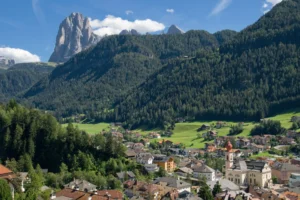 Ortisei with Langkofel - Sassolungo peaking over the hills.
