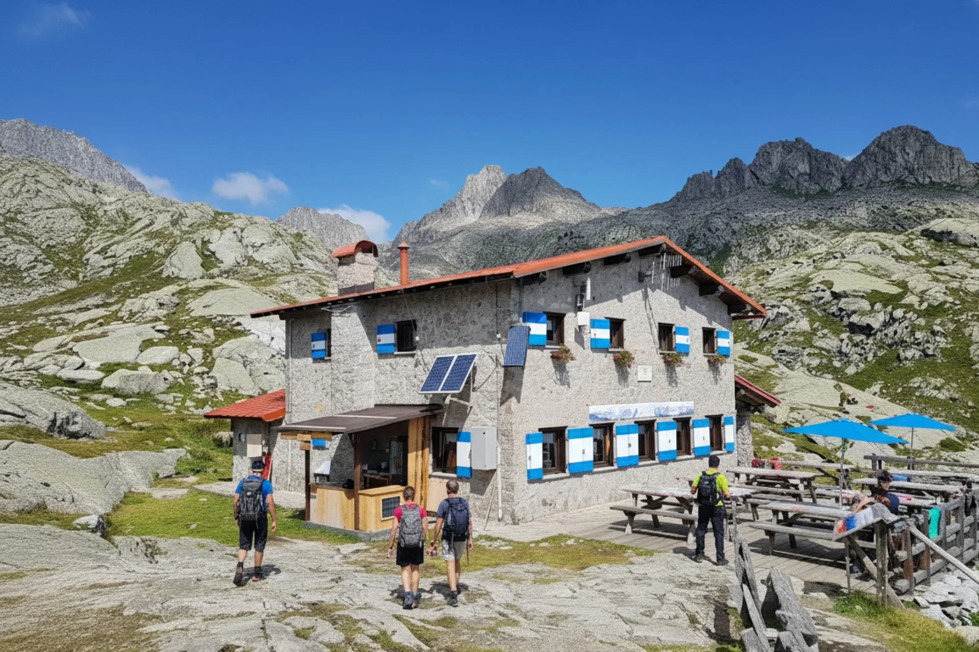 Hikers arriving and relaxing at Rifugio Segantini, Madonna di Campiglio in the Brenta Dolomites.