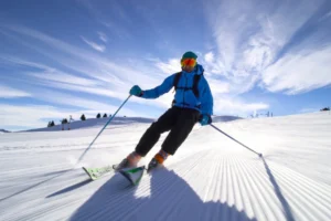 Skier on a pristine groomed run.