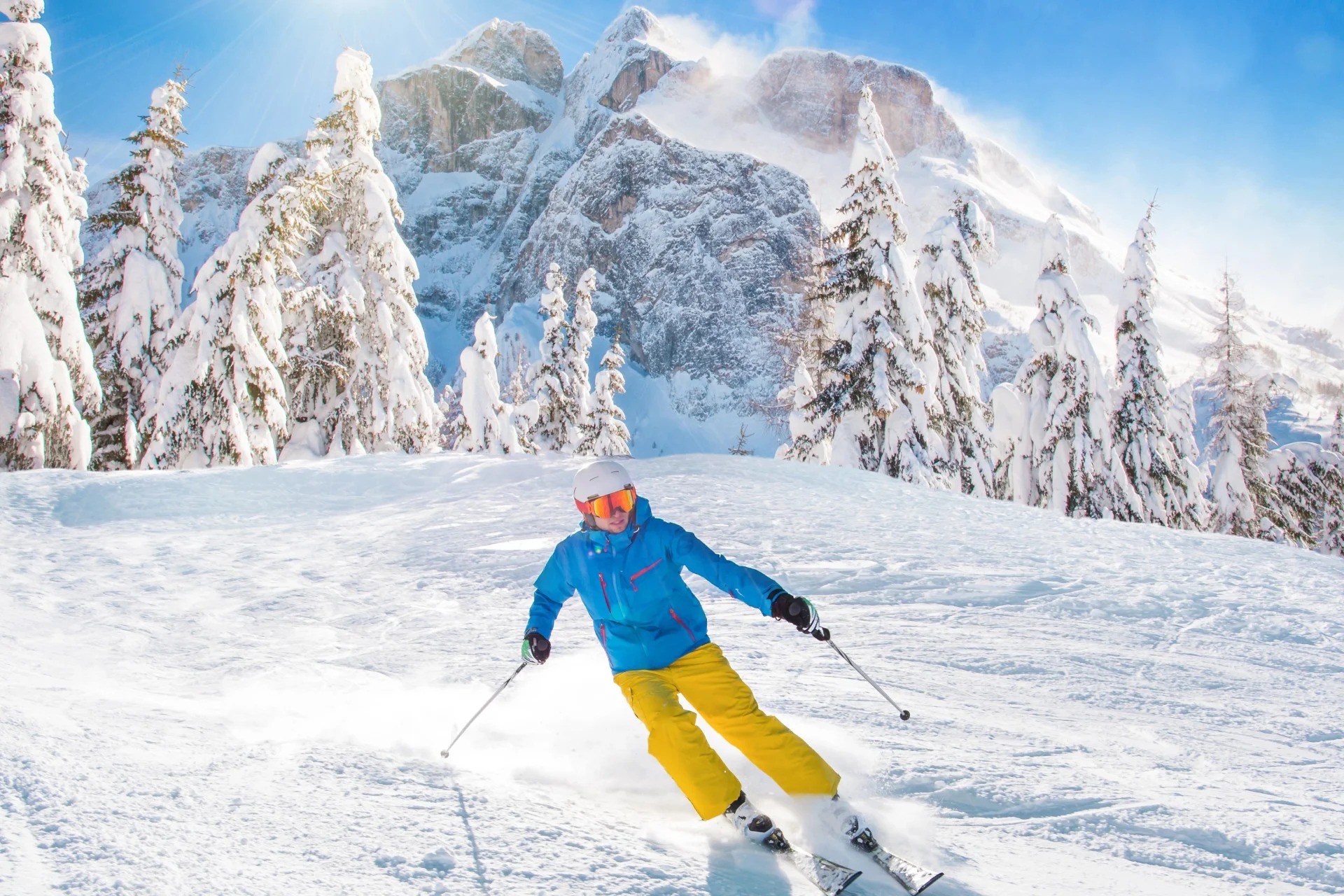 Skier on the slopes in high alps.