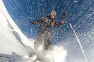 Skier with snow spray.