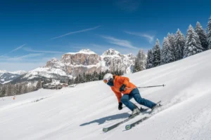 Val di Fassa - female skier on fresh snow.